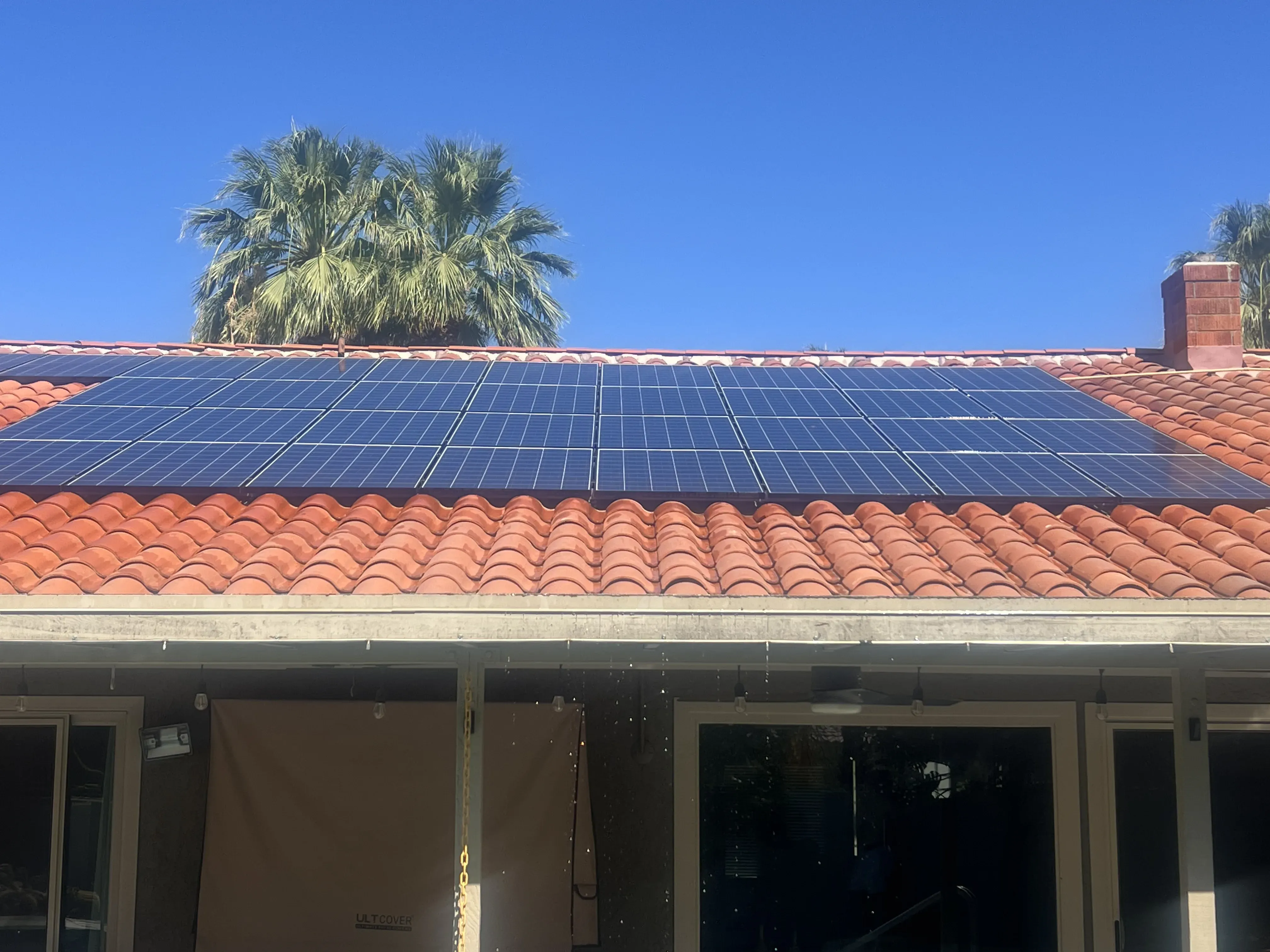 Alternate front-facing view of the home and rooftop solar array